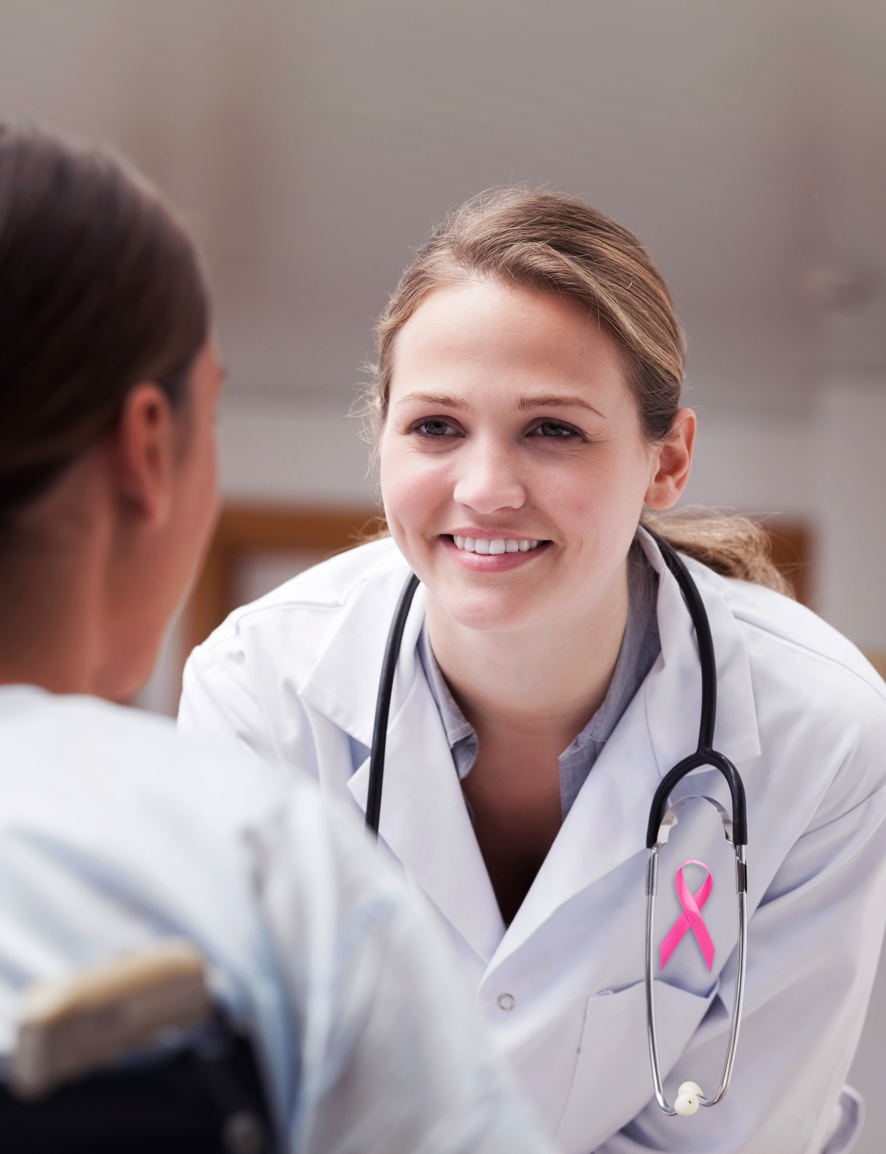 doctor talking to woman about breast cancer